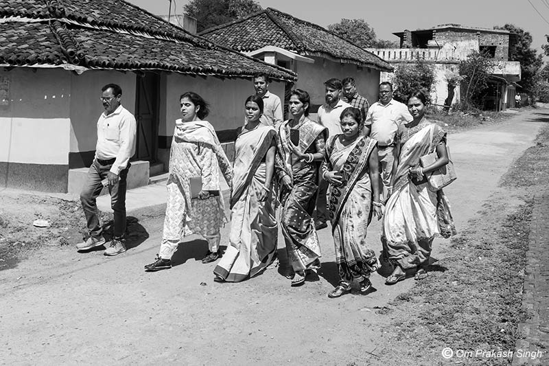 Women members of Village Water and Sanitation Committee (VWSC) marching ahead to show a Jal Jeevan Mission (JJM) scheme to one of the authors in Seraikela-Kharsawan district in Khunti district, Jharkhand, India